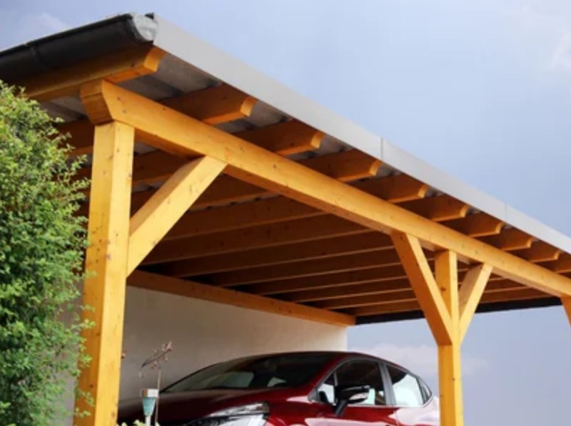 Car parked under a roof for hail protection